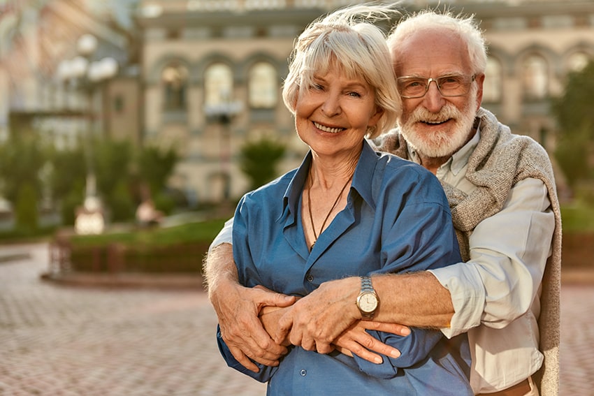 Long lasting love couple embracing - but how long lasteing are their porcelain fillings?