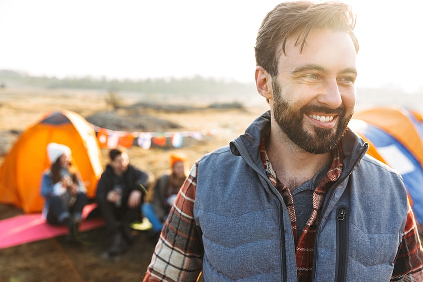 Friends spending time camping with each other, an alternative to an RV