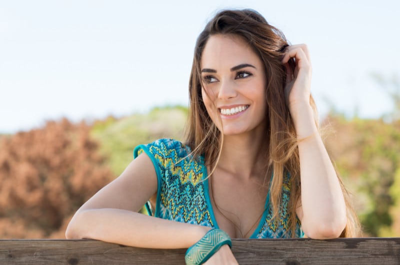 A happpy woman because of her reconstructive dentistry from Dr. Pamela Marzban in Burke Virginia