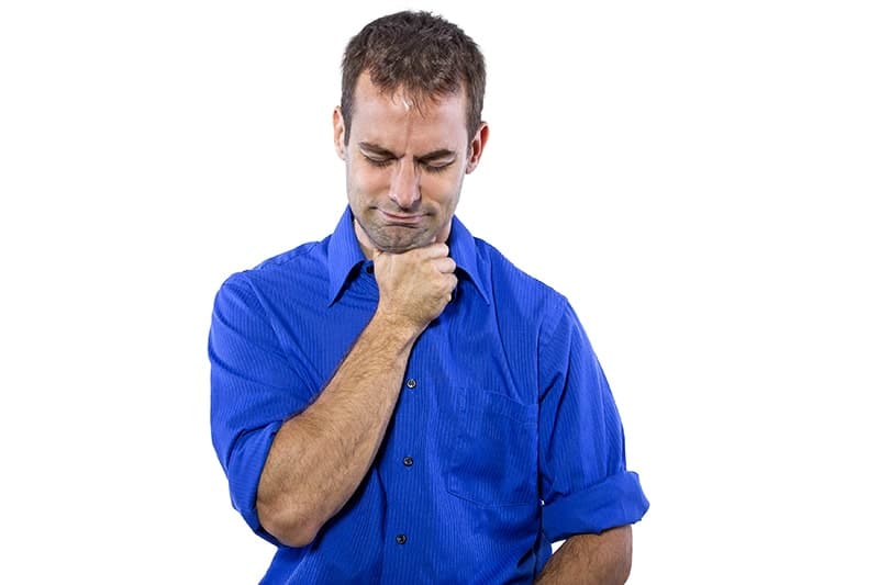 Young businessman in blue collar shirt isolated on a white background holding his throat. He's not able to swallow without trouble. That's where Dr. Pamela Marzban, DDS can help with Myofunctional Therapy